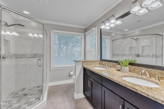 2125 Oakcrest Ct, Raleigh, NC 27612 - bathroom featuring double vanity, tile patterned floors, a shower stall, toilet, and baseboards