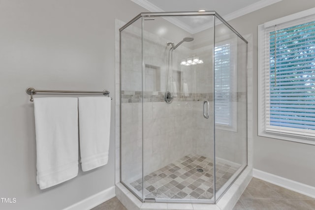 2125 Oakcrest Ct, Raleigh, NC 27612 - full bathroom with ornamental molding, a stall shower, tile patterned floors, baseboards, and plenty of natural light