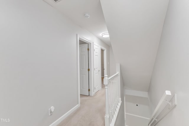 2125 Oakcrest Ct, Raleigh, NC 27612 - hallway with an upstairs landing, baseboards, and light colored carpet