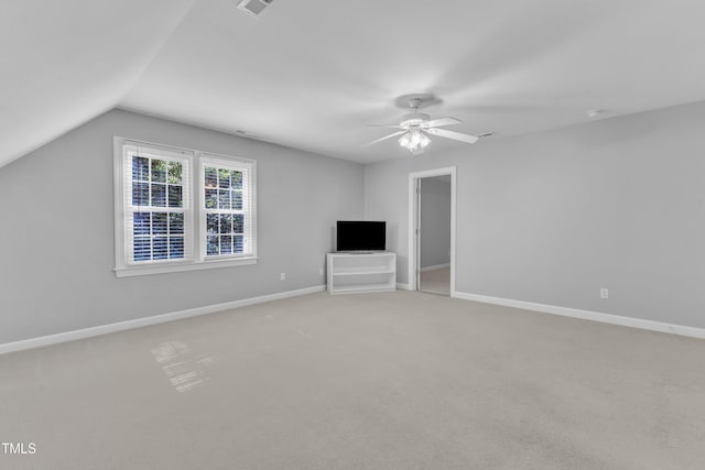 2125 Oakcrest Ct, Raleigh, NC 27612 - unfurnished living room featuring light colored carpet, a ceiling fan, lofted ceiling, and baseboards