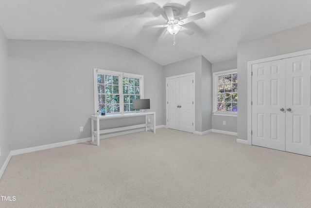 2125 Oakcrest Ct, Raleigh, NC 27612 - unfurnished bedroom with multiple closets, light carpet, lofted ceiling, baseboards, and a ceiling fan