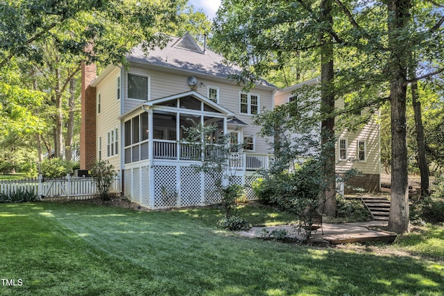 2125 Oakcrest Ct, Raleigh, NC 27612 - back of property with a sunroom, a chimney, and stairway
