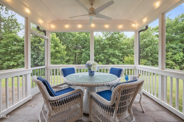 1010 Sandbar Ln, Durham, NC 27703 - sunroom featuring ceiling fan, outdoor dining space, and view of wooded area
