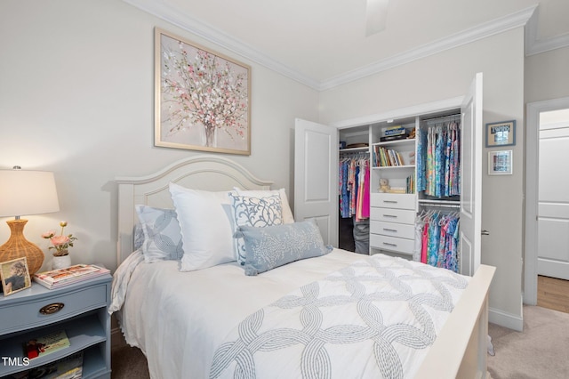 1010 Sandbar Ln, Durham, NC 27703 - carpeted bedroom with crown molding, a closet, and baseboards