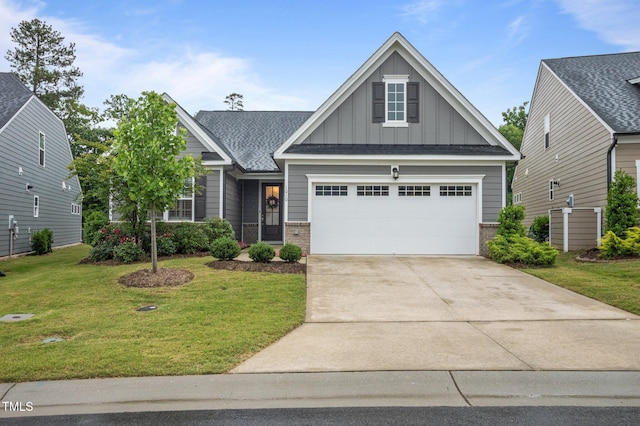 1010 Sandbar Ln, Durham, NC 27703 - craftsman inspired home featuring board and batten siding, brick siding, a front lawn, concrete driveway, and a garage
