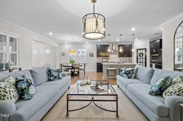 1010 Sandbar Ln, Durham, NC 27703 - living room with light wood-style flooring, recessed lighting, and ornamental molding