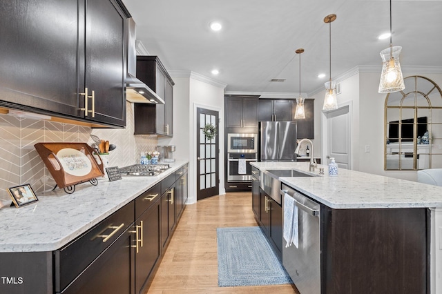 1010 Sandbar Ln, Durham, NC 27703 - kitchen with appliances with stainless steel finishes, a sink, crown molding, tasteful backsplash, and recessed lighting