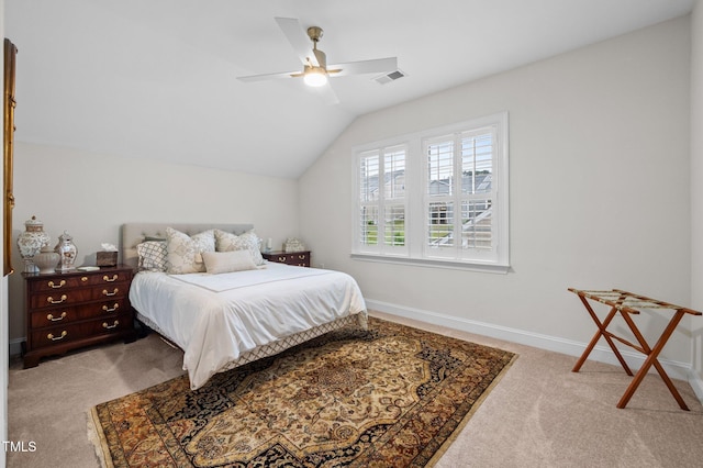 1010 Sandbar Ln, Durham, NC 27703 - bedroom featuring light carpet, vaulted ceiling, baseboards, and ceiling fan