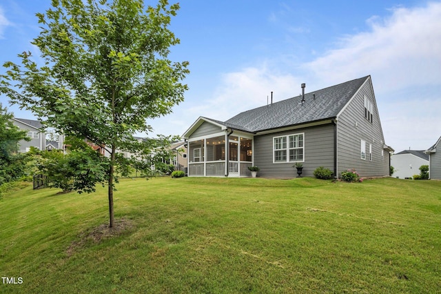 1010 Sandbar Ln, Durham, NC 27703 - rear view of property with a sunroom, a yard, and a shingled roof