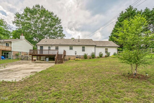 back of house with a wooden deck and stairs