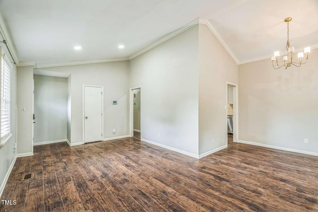 empty room featuring a chandelier, wood finished floors, plenty of natural light, ornamental molding, and recessed lighting