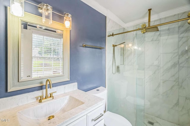 bathroom with crown molding, a marble finish shower, toilet, and vanity
