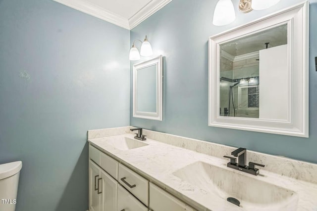bathroom with ornamental molding, tiled shower, double vanity, and toilet