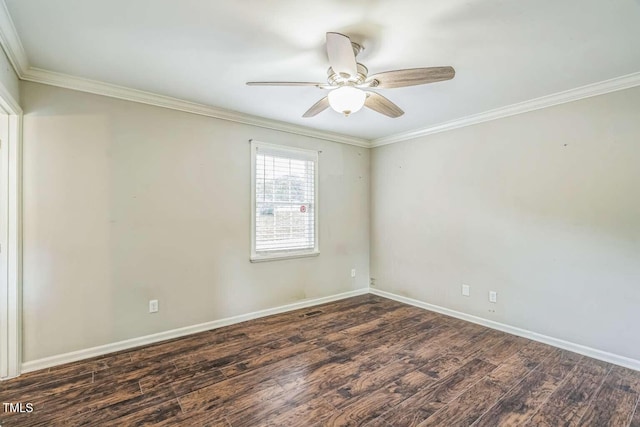 spare room featuring ornamental molding, wood finished floors, baseboards, and a ceiling fan