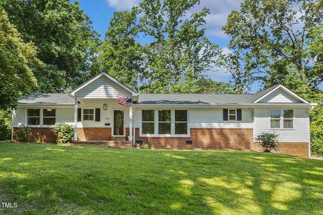 418 S W St, Cary, NC 27511 - view of front of house featuring a front yard and brick siding