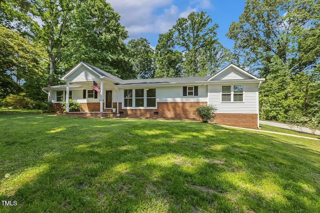 418 S W St, Cary, NC 27511 - ranch-style house featuring a porch, brick siding, and a front lawn