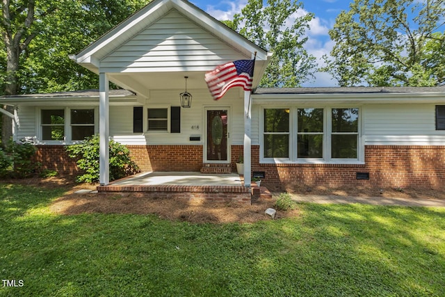 418 S W St, Cary, NC 27511 - view of front of house with a front yard and brick siding