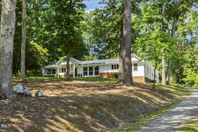 418 S W St, Cary, NC 27511 - ranch-style house with driveway, a porch, and brick siding