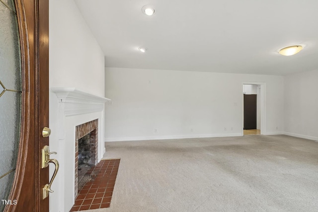 418 S W St, Cary, NC 27511 - unfurnished living room featuring carpet, a fireplace, and baseboards