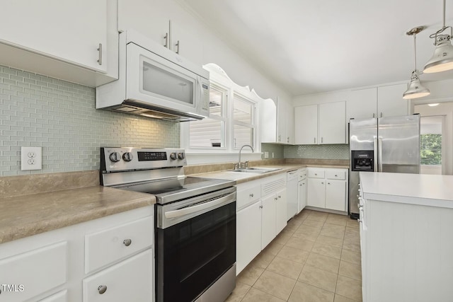 418 S W St, Cary, NC 27511 - kitchen with appliances with stainless steel finishes, a sink, tasteful backsplash, light tile patterned floors, and white cabinets