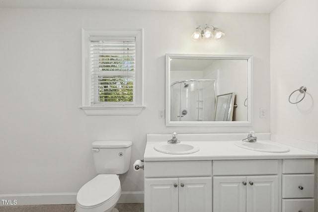 418 S W St, Cary, NC 27511 - full bath featuring a stall shower, double vanity, baseboards, and toilet