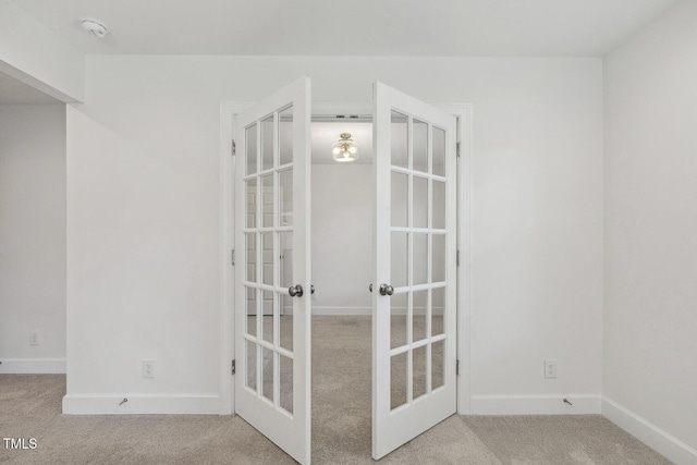 418 S W St, Cary, NC 27511 - carpeted spare room with french doors, baseboards, and a smoke detector