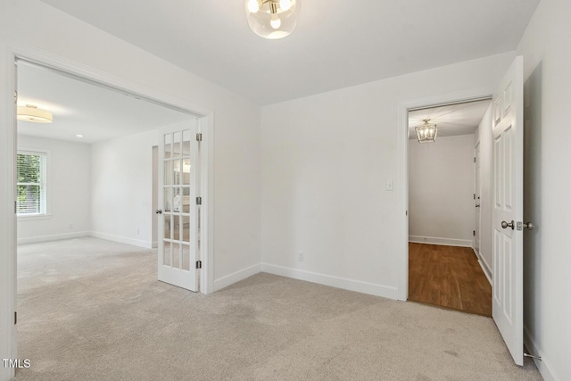 418 S W St, Cary, NC 27511 - carpeted spare room with baseboards and a chandelier
