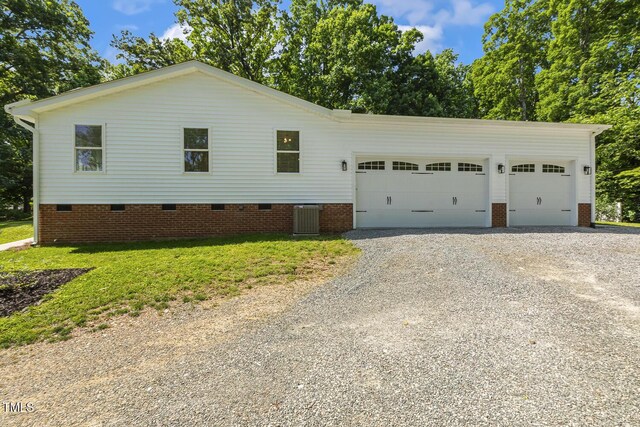 418 S W St, Cary, NC 27511 - view of side of home featuring driveway, central AC unit, a garage, and crawl space