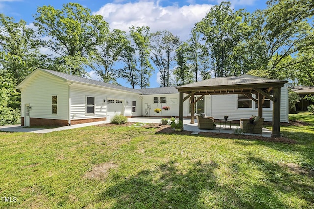 418 S W St, Cary, NC 27511 - rear view of house featuring a gazebo, a garage, a lawn, a patio, and an outdoor living space