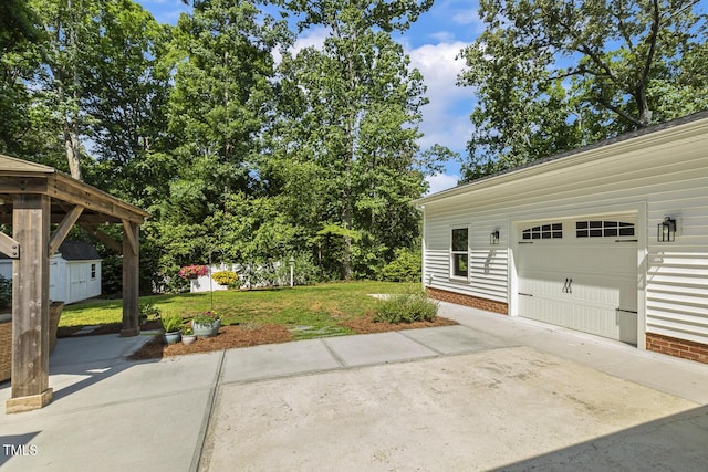 418 S W St, Cary, NC 27511 - view of green lawn featuring driveway, an outbuilding, and an attached garage