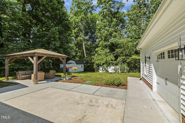 418 S W St, Cary, NC 27511 - view of patio with an outdoor living space, a gazebo, an outdoor structure, and view of wooded area