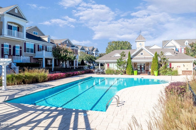 9211 Calabria Dr Unit 104, Raleigh, NC 27617 - community pool with a residential view, a patio, and french doors
