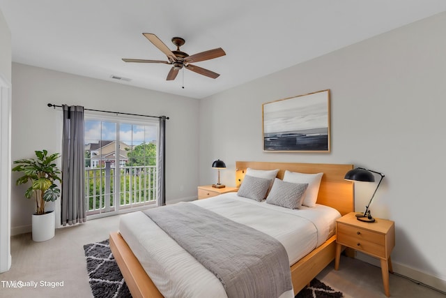9211 Calabria Dr Unit 104, Raleigh, NC 27617 - bedroom with baseboards, a ceiling fan, and carpet flooring
