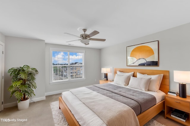 9211 Calabria Dr Unit 104, Raleigh, NC 27617 - bedroom featuring light colored carpet, baseboards, and a ceiling fan