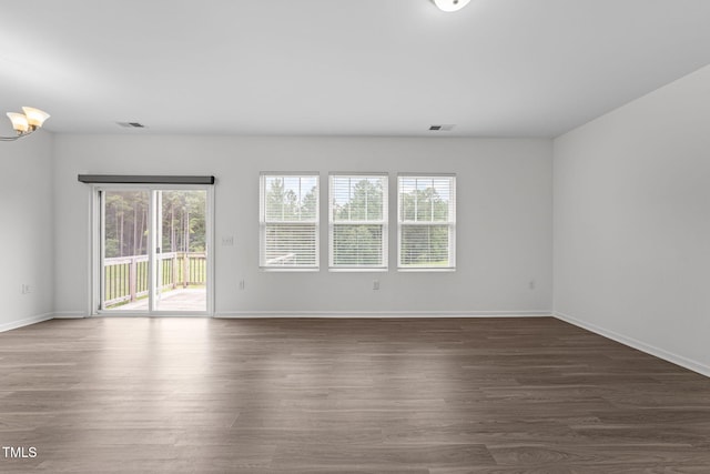 1151 Epiphany Rd, Morrisville, NC 27560 - unfurnished room featuring dark wood-type flooring and a chandelier