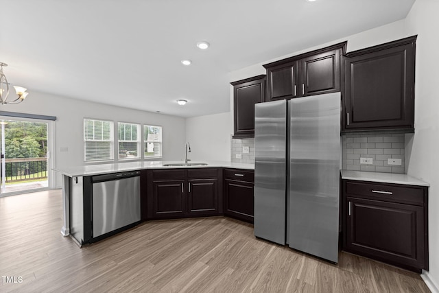 1151 Epiphany Rd, Morrisville, NC 27560 - kitchen with stainless steel appliances, light countertops, plenty of natural light, light wood-style flooring, and recessed lighting