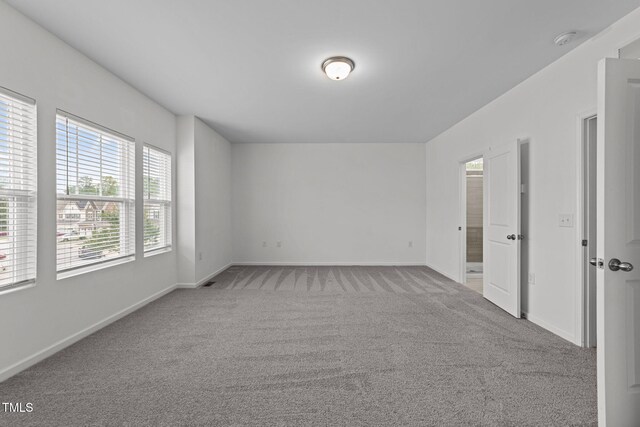 1151 Epiphany Rd, Morrisville, NC 27560 - spare room with a smoke detector and carpet flooring