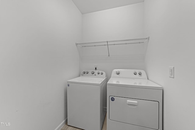 1151 Epiphany Rd, Morrisville, NC 27560 - laundry area featuring separate washer and dryer and baseboards