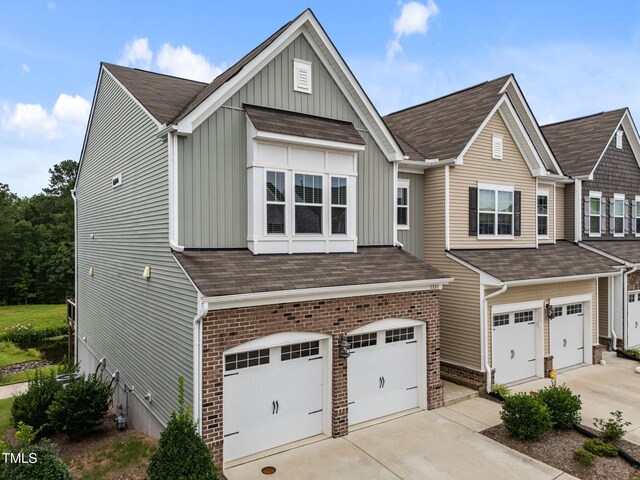 1151 Epiphany Rd, Morrisville, NC 27560 - view of front of home featuring a garage, board and batten siding, and concrete driveway
