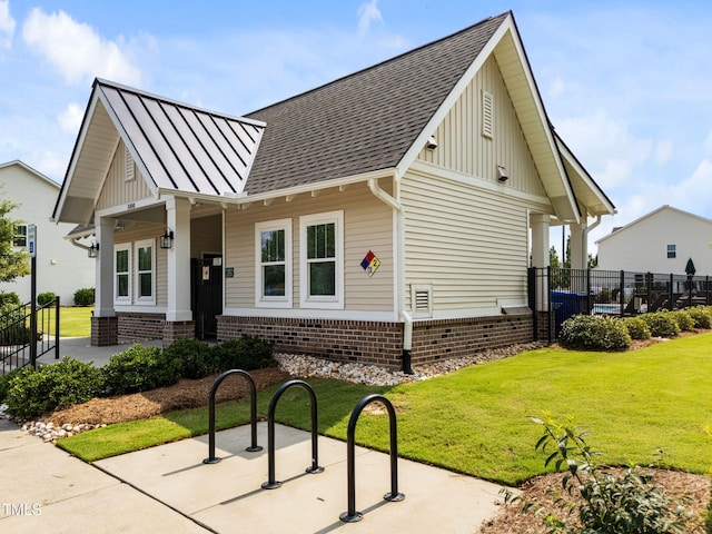 1151 Epiphany Rd, Morrisville, NC 27560 - view of front facade featuring a shingled roof, a standing seam roof, and board and batten siding
