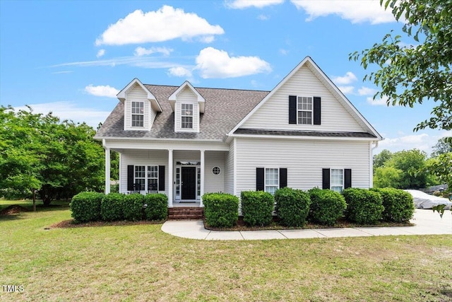 509 Spruce Meadows Ln, Willow Springs, NC 27592 - view of front facade with a front lawn, a shingled roof, and covered porch