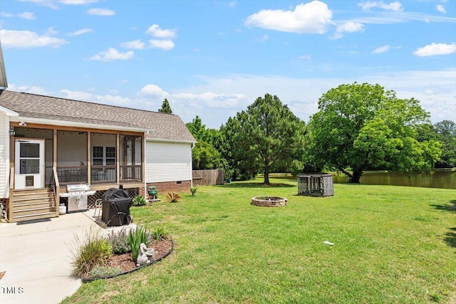 509 Spruce Meadows Ln, Willow Springs, NC 27592 - view of green lawn featuring an outdoor fire pit, a patio, entry steps, and a water view