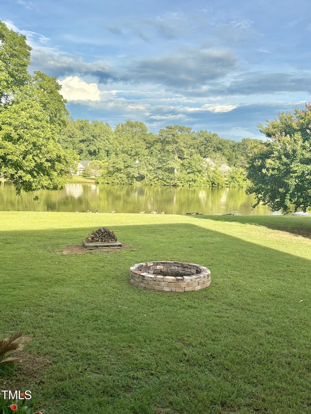 509 Spruce Meadows Ln, Willow Springs, NC 27592 - view of grassy yard featuring a fire pit and a water view