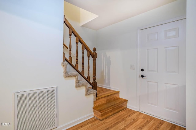 106 Redbud, Pittsboro, NC 27312 - entryway with light wood-style floors, stairs, and baseboards