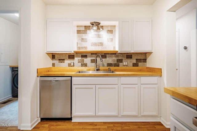 106 Redbud, Pittsboro, NC 27312 - kitchen featuring stainless steel dishwasher, a sink, wooden counters, and tasteful backsplash