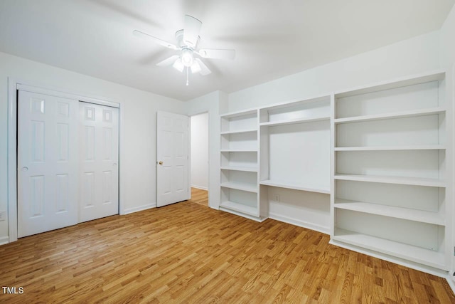106 Redbud, Pittsboro, NC 27312 - unfurnished bedroom with light wood-type flooring, baseboards, and a ceiling fan