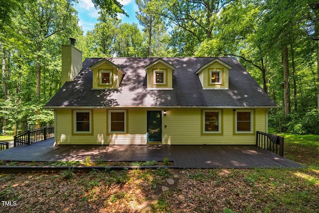 106 Redbud, Pittsboro, NC 27312 - new england style home featuring a chimney and a deck