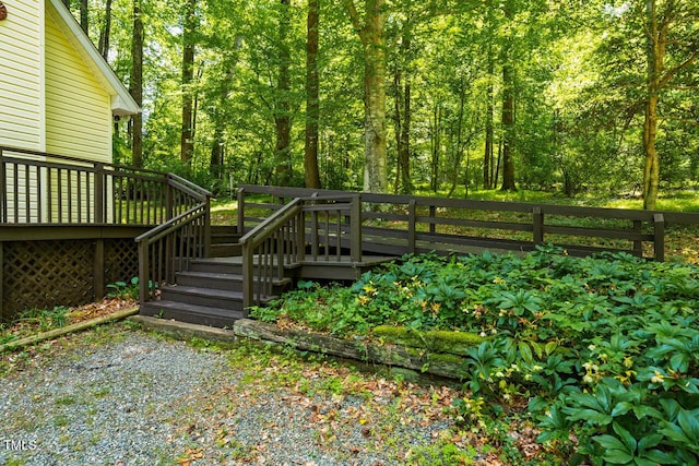 106 Redbud, Pittsboro, NC 27312 - view of yard featuring a deck and a wooded view