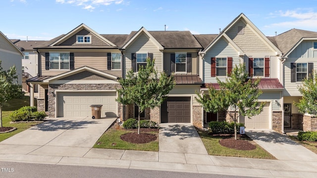 506 Oak Forest View Ln, Wake Forest, NC 27587 - view of front facade featuring an attached garage, concrete driveway, and stone siding