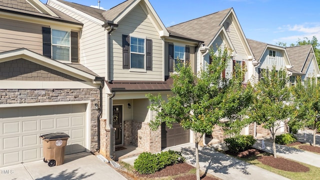 506 Oak Forest View Ln, Wake Forest, NC 27587 - townhome / multi-family property with driveway, a garage, and stone siding